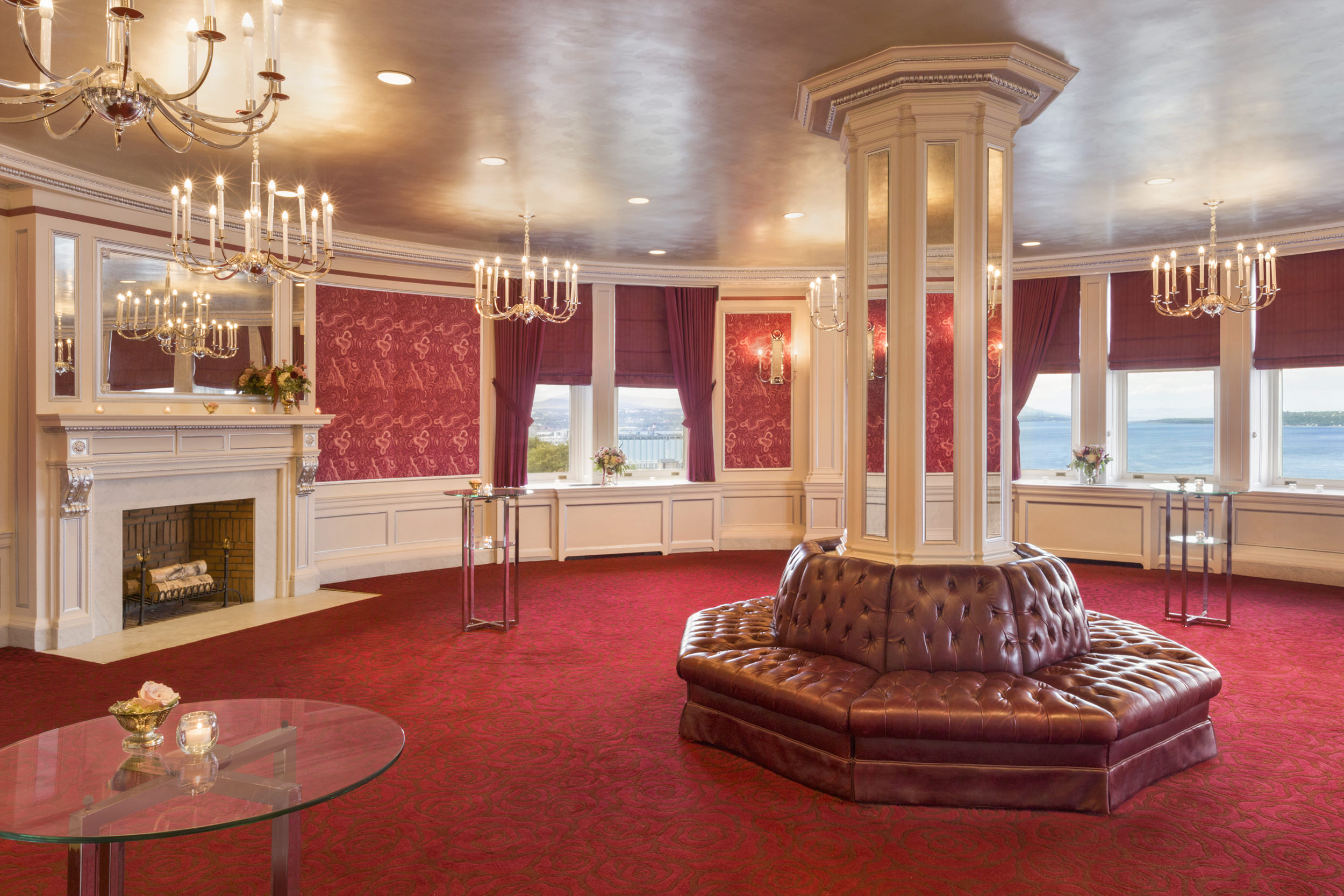 circular meeting room with red walls and carpet