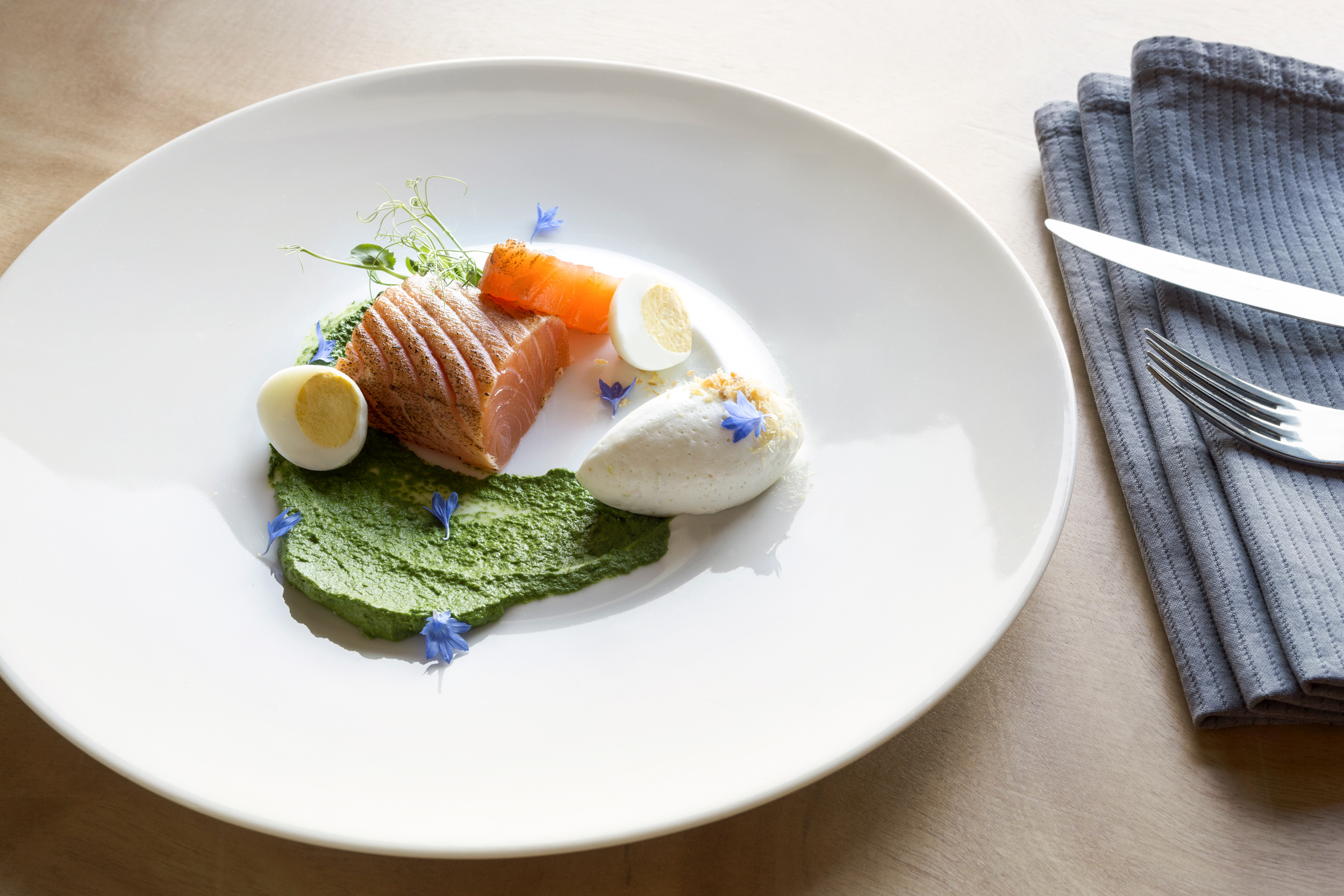 fish, eggs, and vegetables plated