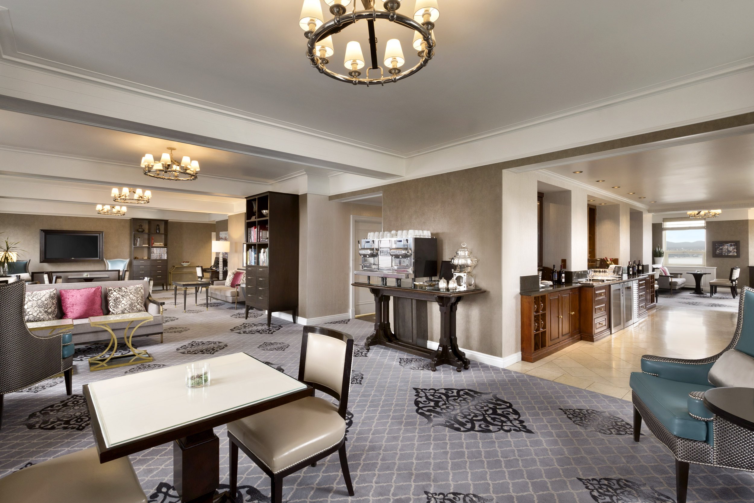 hotel room with view of living room, kitchen, and dining room