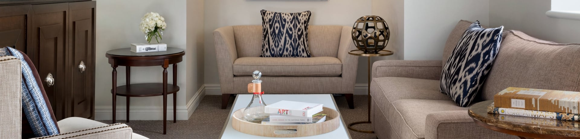 living room with light tan sofas