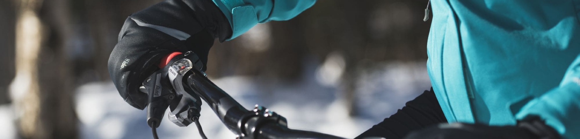 close up of someones hands on bike handles