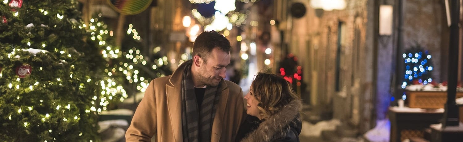 a couple walking through the decorated streets