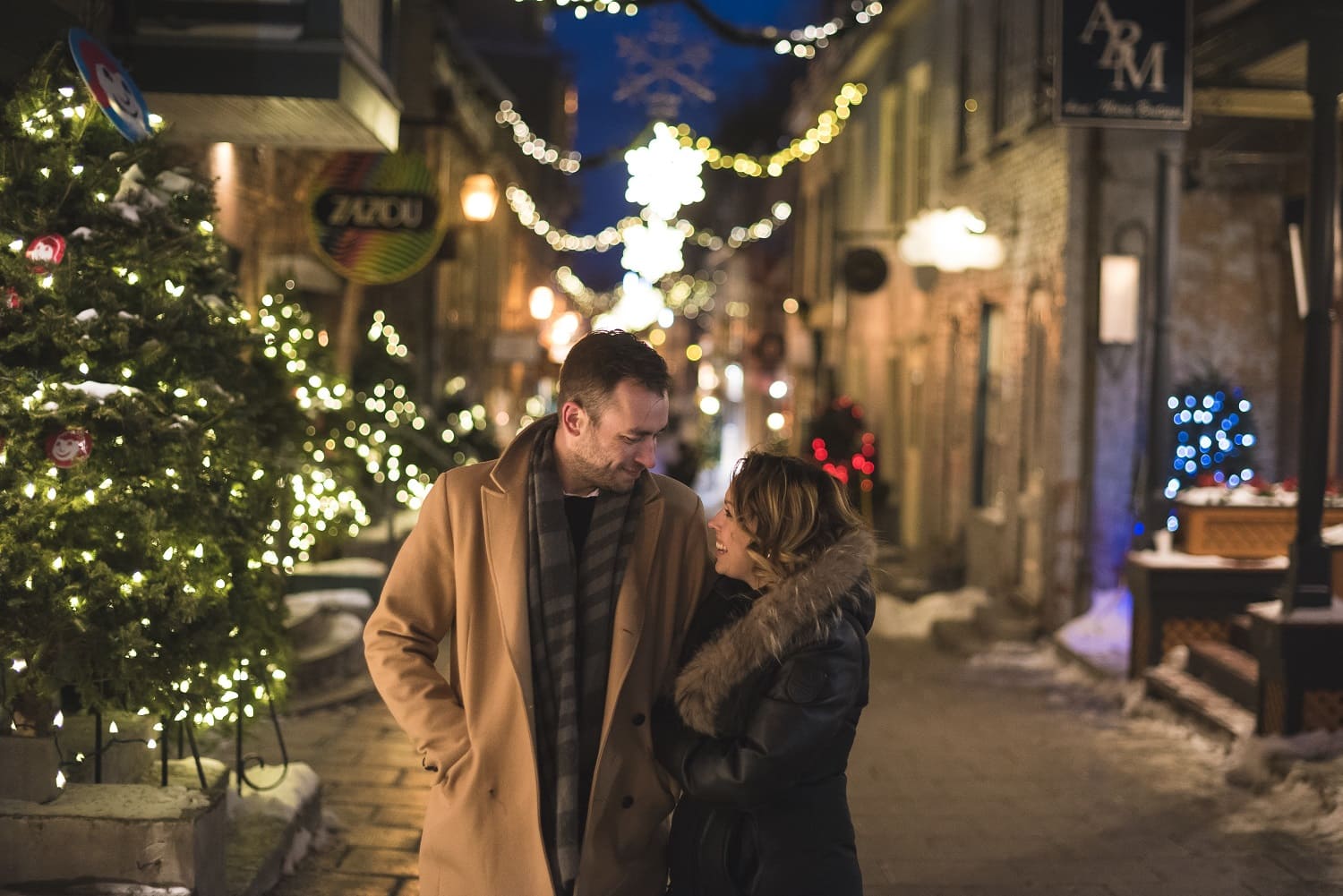 a couple walking through the decorated streets