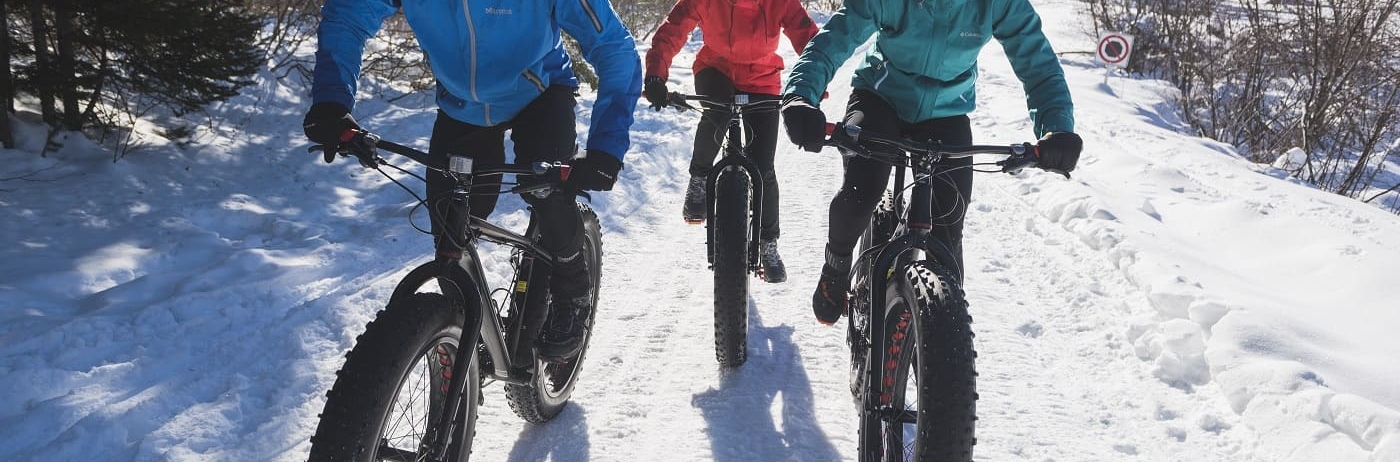 three people on bikes