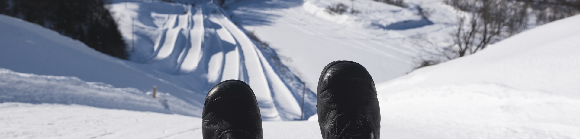 Person sledding down a hill
