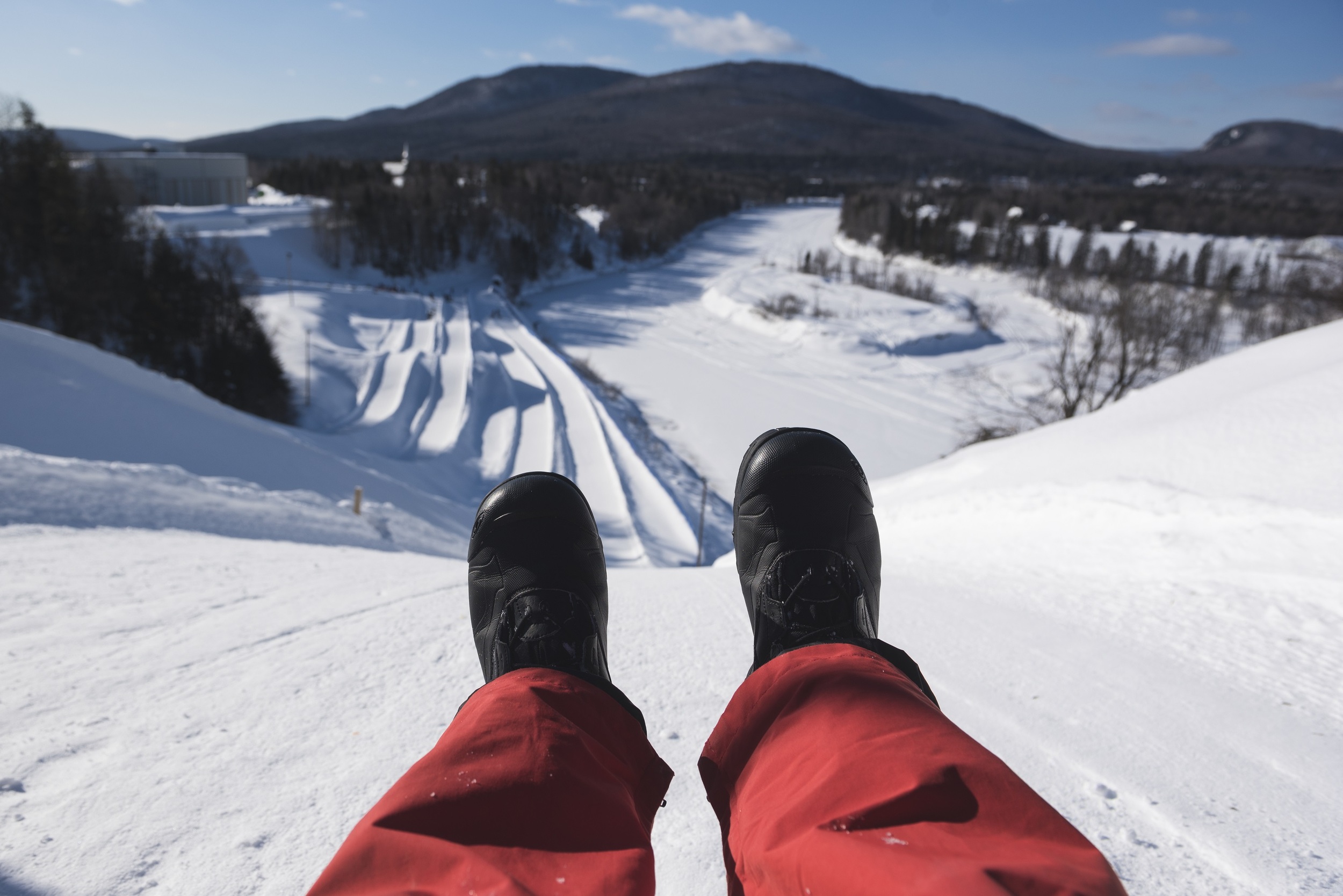 Person sledding down a hill