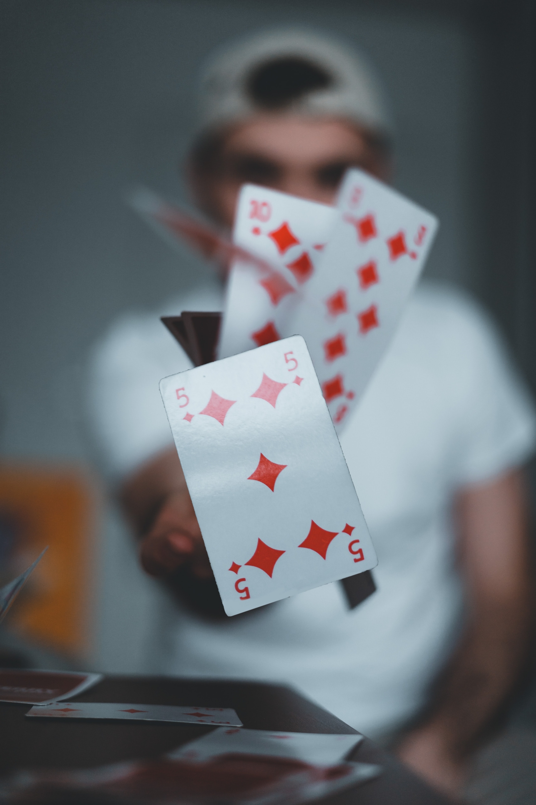 cards being flung by magician