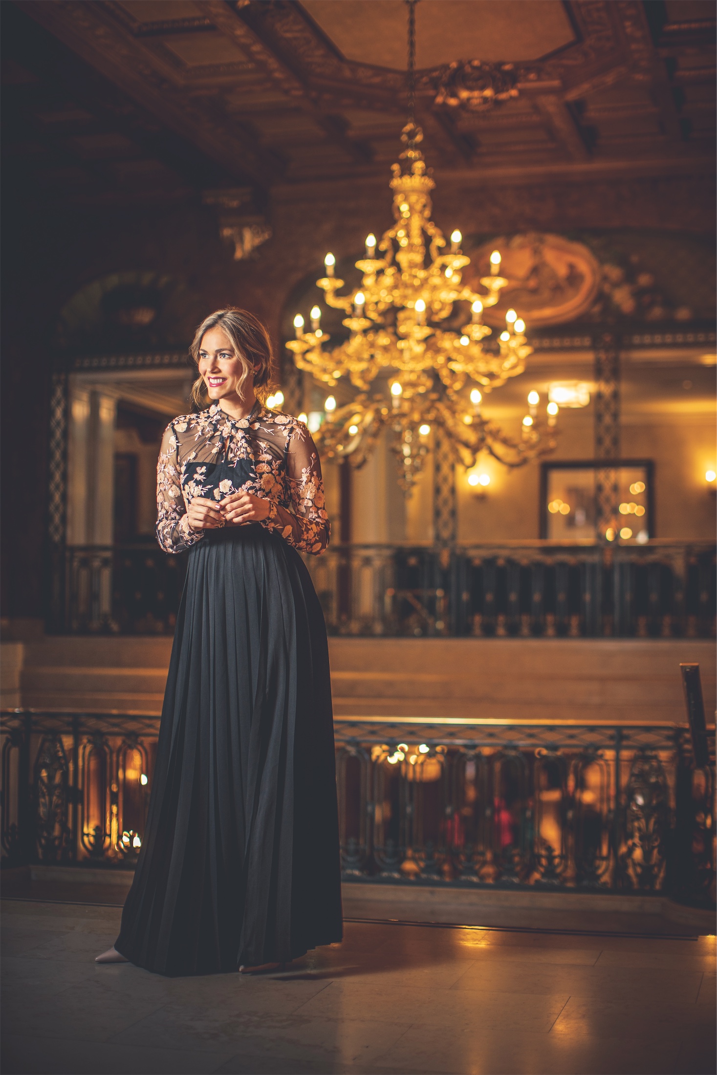 Woman in festive attire in the Frontenac Ballroom